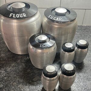Vintage Silver Canister Set & 4 spice canisters with Black Lids. Very good co